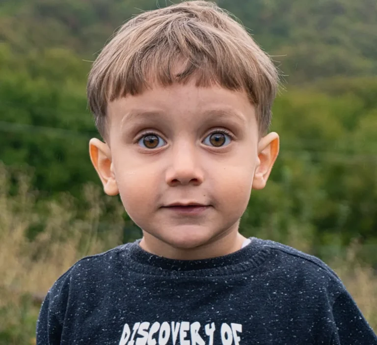 A heartwarming portrait of Tedi Kostava, young son of Georgian artist Zurab Kostava, looking thoughtfully. Photo by Zurab Kostava.